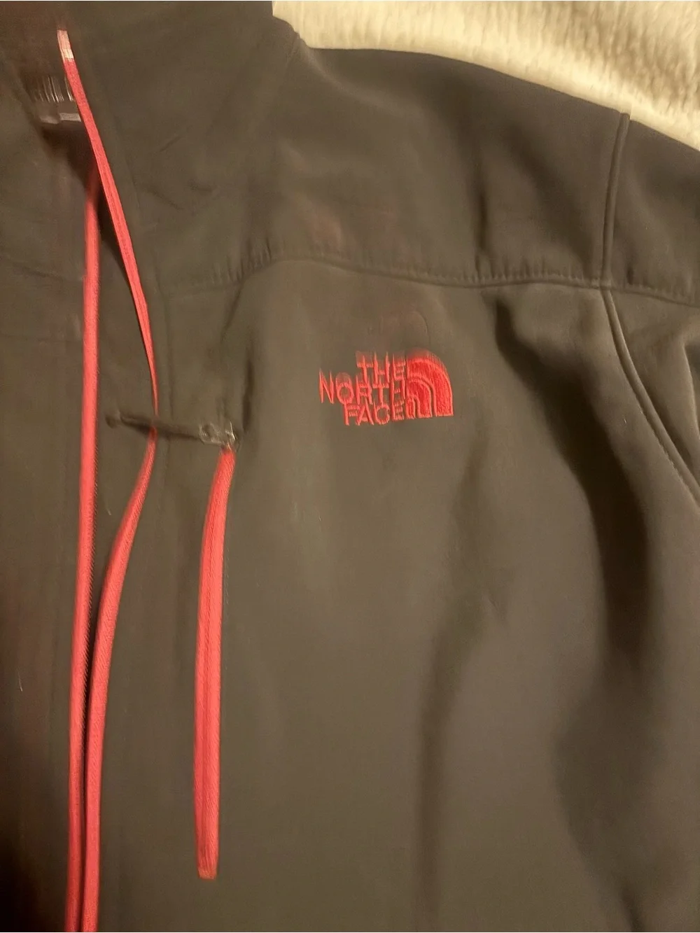 The North Face Men's Black Jacket with Red Accents